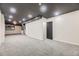 Spacious basement featuring neutral carpet, recessed lighting, and light beige walls at 624 S Depew St # C, Lakewood, CO 80226