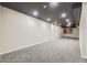 Spacious basement featuring neutral-colored walls, carpeted floors, and recessed lighting at 624 S Depew St # C, Lakewood, CO 80226