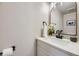Modern bathroom featuring a white countertop, black faucet, and elegant decor at 624 S Depew St # C, Lakewood, CO 80226