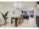 Elegant dining area with contemporary lighting flowing into a modern kitchen with a functional island at 624 S Depew St # C, Lakewood, CO 80226