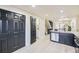 Modern kitchen with stainless steel appliances, ample storage, and a view of the adjacent living spaces at 624 S Depew St # C, Lakewood, CO 80226