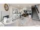 Inviting living room seamlessly connects to the kitchen, highlighted by modern décor and sleek flooring at 624 S Depew St # C, Lakewood, CO 80226