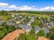Sprawling residential area featuring various townhomes and lush landscaping, complete with a community pool at 6813 W Yale Ave, Lakewood, CO 80227