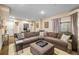 Spacious basement living area with a large sectional sofa, perfect for entertaining and relaxation at 6813 W Yale Ave, Lakewood, CO 80227