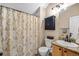Clean bathroom featuring shower, a cabinet for storage, and a sink with modern finishes and fixtures at 6813 W Yale Ave, Lakewood, CO 80227