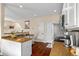 Bright kitchen featuring white cabinets, stainless steel appliances, and countertops at 6813 W Yale Ave, Lakewood, CO 80227