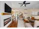 Spacious living room featuring fireplace, staircase and hardwood floors at 6813 W Yale Ave, Lakewood, CO 80227