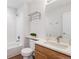 Updated bathroom features a shower-tub combo, oak cabinets, and quartz countertop at 8251 W 54Th Ave # 4, Arvada, CO 80002