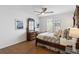 Bedroom with hardwood floor, ceiling fan, natural light, and large window at 8251 W 54Th Ave # 4, Arvada, CO 80002
