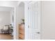 Hallway leading to a sitting room with a modern chair and dresser at 8251 W 54Th Ave # 4, Arvada, CO 80002