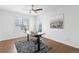 Home office featuring hardwood floors, ceiling fan, natural light, a comfortable desk, and nice art at 8251 W 54Th Ave # 4, Arvada, CO 80002