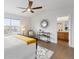 Main bedroom features light filled windows, ceiling fan, wood floors, and an attached bathroom at 8251 W 54Th Ave # 4, Arvada, CO 80002