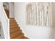 Open staircase featuring wooden steps and white railings at 8251 W 54Th Ave # 4, Arvada, CO 80002