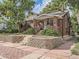 Brick home with landscaped yard and stone retaining wall at 2303 - 2305 W 32Nd Ave, Denver, CO 80211