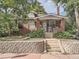 Brick home with front porch, steps, and landscaping at 2303 - 2305 W 32Nd Ave, Denver, CO 80211