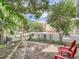 Landscaped front yard with red chairs at 2303 - 2305 W 32Nd Ave, Denver, CO 80211