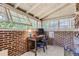 Bright home office features exposed brick walls, built-in shelving and large windows at 2303 - 2305 W 32Nd Ave, Denver, CO 80211