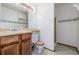 Well-maintained bathroom featuring a vanity with storage and a walk-in shower at 18083 E Atlantic Dr, Aurora, CO 80013