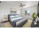 Comfortable bedroom featuring a large bed, ample natural light, and calming decor at 18083 E Atlantic Dr, Aurora, CO 80013