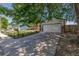 Charming home with a well-manicured lawn, a driveway, a two-car garage, and mature shade trees at 18083 E Atlantic Dr, Aurora, CO 80013