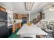 Well-lit kitchen with sleek countertops, stainless steel appliances, and open floor plan at 18083 E Atlantic Dr, Aurora, CO 80013