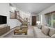 Inviting living room featuring stylish furnishings, a staircase, and neutral decor at 18083 E Atlantic Dr, Aurora, CO 80013