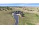 Expansive aerial view showcases this amazing home's setting and beautiful lawn at 575 Howling Cir, Elizabeth, CO 80107