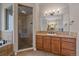 Bathroom with a glass shower and a sink with granite countertop and vanity at 575 Howling Cir, Elizabeth, CO 80107