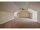 Spacious carpeted bonus room with high ceilings, and a modern ceiling fan at 575 Howling Cir, Elizabeth, CO 80107