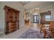 Inviting foyer leading to a dining area and living room, showcasing an elegant chandelier at 575 Howling Cir, Elizabeth, CO 80107