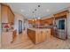 Gourmet kitchen with granite counters, a large island and stainless steel appliances at 575 Howling Cir, Elizabeth, CO 80107