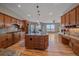 Gourmet kitchen with granite counters, an island and stainless steel appliances at 575 Howling Cir, Elizabeth, CO 80107