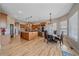 Spacious kitchen with wood cabinets, an island, stainless appliances and dining area at 575 Howling Cir, Elizabeth, CO 80107