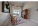 Bright living room features a rug and comfortable chairs near a window and decorative armoire at 575 Howling Cir, Elizabeth, CO 80107