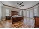 Spacious main bedroom featuring hard wood floors, and bay windows at 575 Howling Cir, Elizabeth, CO 80107
