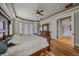 Bright main bedroom featuring hard wood floors, a ceiling fan and access to the exterior at 575 Howling Cir, Elizabeth, CO 80107