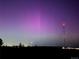 Scenic night landscape showcasing purple Northern Lights, with a red-lit cell tower at 575 Howling Cir, Elizabeth, CO 80107