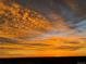 Beautiful sunset with colorful, bright orange and gray cloudscape at 575 Howling Cir, Elizabeth, CO 80107