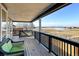 Spacious deck with seating offers scenic views of open space and water at 5895 E Conservation Dr, Frederick, CO 80504