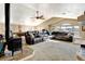 Expansive living room with a pellet stove, pool table, and leather sectional sofa at 5895 E Conservation Dr, Frederick, CO 80504