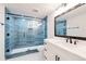 Modern bathroom featuring new tile, a sleek glass shower, and contemporary fixtures at 6220 E 5Th Ave, Denver, CO 80220