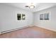 Bright bedroom with large windows, neutral carpet, and minimalist style at 6220 E 5Th Ave, Denver, CO 80220