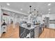 Open-concept kitchen offering a center island with modern appliances and seamless flow to living area at 6220 E 5Th Ave, Denver, CO 80220