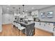 Contemporary kitchen features a large island with seating and stainless steel appliances at 6220 E 5Th Ave, Denver, CO 80220