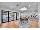 Open floor plan with dining and living areas featuring modern finishes and an abundance of natural light at 6220 E 5Th Ave, Denver, CO 80220