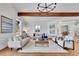 Cozy living room with comfortable seating, stylish decor, hardwood floors, and natural light streaming through the windows at 6220 E 5Th Ave, Denver, CO 80220