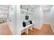 Hallway mudroom with built-in bench, storage, and hooks at 6220 E 5Th Ave, Denver, CO 80220