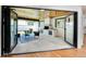 Charming outdoor patio with a brick fireplace, comfortable seating, and folding glass doors to seamlessly integrate indoor and outdoor spaces at 6220 E 5Th Ave, Denver, CO 80220