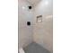 Modern shower with sleek gray tile and a black rainfall showerhead, including a built-in niche at 6220 E 5Th Ave, Denver, CO 80220