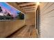 Private outdoor balcony with wooden floor overlooks peaceful surroundings at 3662 S Granby Way # J05, Aurora, CO 80014